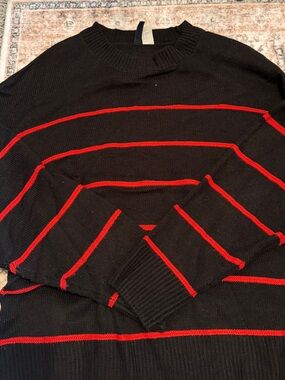 Divided Black Crewneck Sweater with Red Stripes